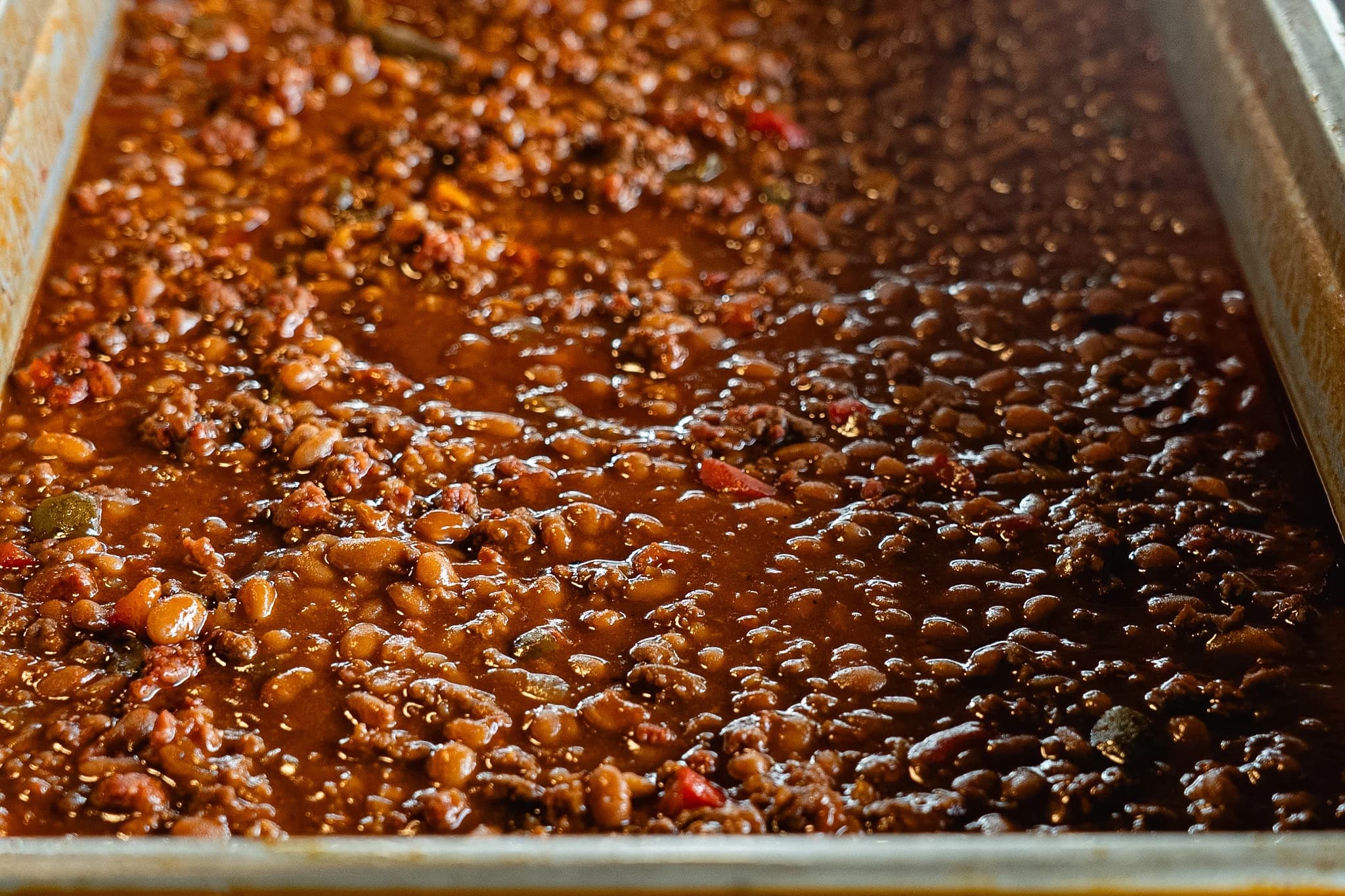 Smoked loaded baked beans with ground beef, peppers, and onion.