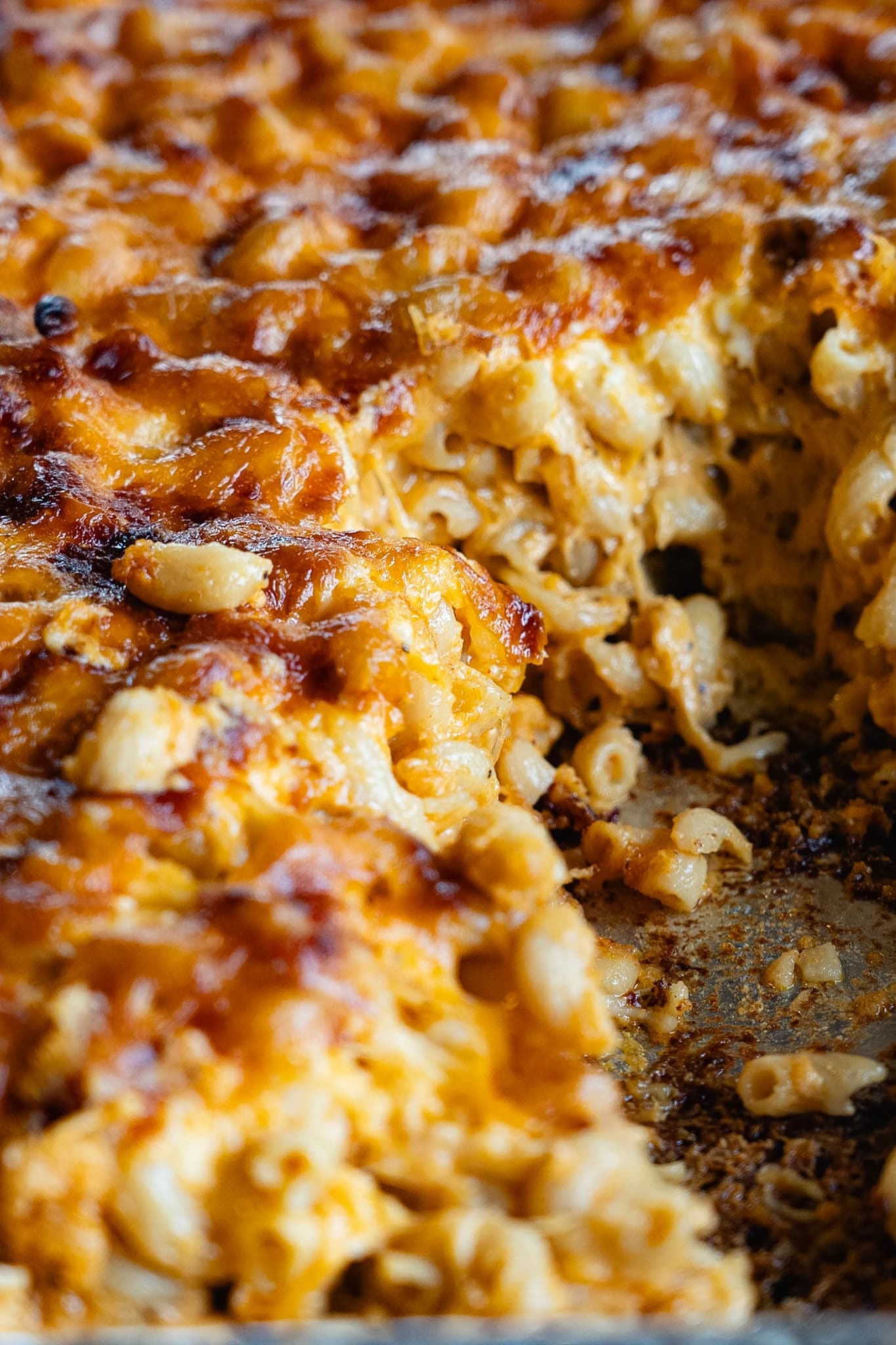 A tray of smoked three-cheese macaroni with a deeply browned top.